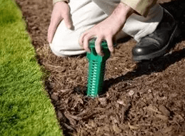 Technician Installing the Sentricon® Termite Colony Elimination System